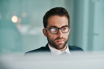 Office, thinking and businessman with ideas, glasses and planning for economic trends and professional. Confident, stockbroker and contemplating for political events, market volatility and stocks