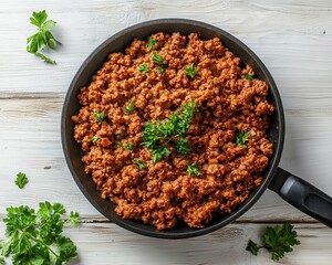 Wall Mural - Top view of minced meat in pan on white wooden table