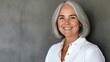 © Krystian - Graceful Older Woman with Gray Hair Smiling in Casual White Shirt Portrait