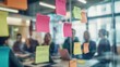 © basketman23 - Group brainstorming session with sticky notes on a glass wall