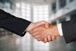 © BillionPhotos.com - Strong handshake of business professionals partnership.