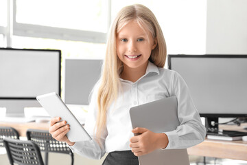 Poster - Little girl with modern devices at school computer lab