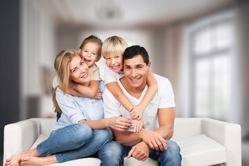 Wall Mural - Happy young family posing together at home