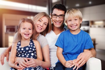 Canvas Print - Happy young family posing together at home