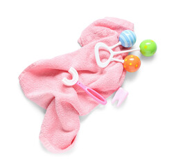 Wall Mural - Towel with children's toothbrush, dental floss and toy on white background