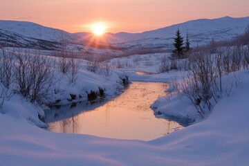 Wall Mural - Snow-covered valley with a frozen stream at sunset