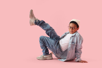 Poster - Little African-American boy in adult clothes on pink background