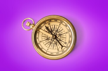 vintage golden brass compass on background
