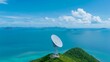 © naphat - Global Connectivity: Satellite Dish Network Providing Telecommunication Services over a Remote Island with Copy Space