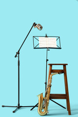 Poster - Saxophone, microphone and stand with notes on blue background