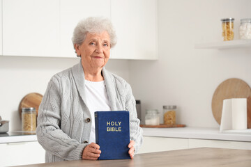 Poster - Senior woman with Bible at home