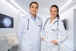© BillionPhotos.com - Portrait of two doctors smiling standing in medical consultation.
