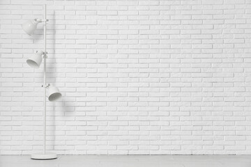 Wall Mural - Floor lamp near white brick wall in room