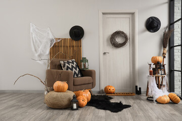 Wall Mural - Interior of hallway decorated for Halloween with door, armchair and pumpkins