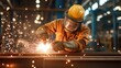 © Sumet - A skilled welder in protective gear works on metal, creating sparks in a well-lit industrial workshop.
