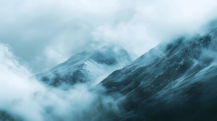 Wall Mural - misty mountain range partially obscured by clouds as rain falls gently across the slopes