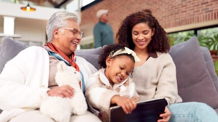 Poster - Black family, smile and laughing with tablet on sofa for funny video, bonding and streaming game in morning. Happy, women and child with digital for care, teddybear and online storytelling at house