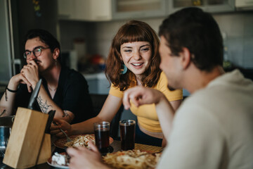 Poster - A group of young friends sitting at a kitchen table, engaging in conversation and enjoying a meal together. The atmosphere is casual and friendly.