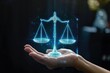 © kitipol - Hand holding a hologram of balance scale, symbolizing legal advice and justice