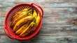 © Nasnunt - Ripe plantains in a red basket , yellow, ripe, plantains, cluster, bunch, basket, tropical, fruit, food, vibrant, ripe