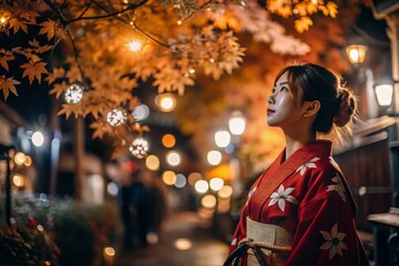 A Japanese girl in a traditional national costume - a kimono. On a fabulous background of lanterns and autumn trees. The portrait symbolizes the traditions and culture of the people of Japan.