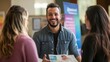 © Elmira - A smiling man interacts with two women at a health awareness booth, sharing information and fostering discussions about health and wellness in a community setting