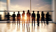 © Who is Danny - Crowd of backlit businesspeople in blurry office with panoramic city and sky view. Team, future and success concept. Double exposure.