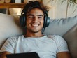 © Alexander Chaykin - Relaxed Young Man Listening to Headphones
