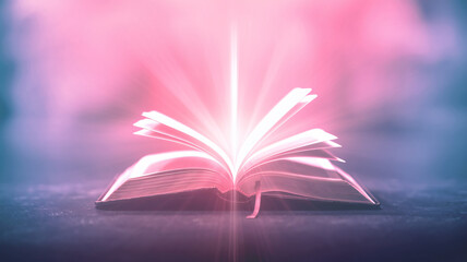 Wall Mural - Open bible on background with rays of light and smoke