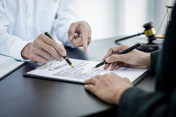 Wall Mural - Male lawyer or notary working consulting and discussion to businesswoman client in the office, Law and Legal services concept