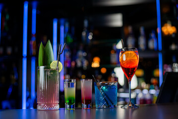 Cocktails set on a bar at Casino. Cocktails assortment.