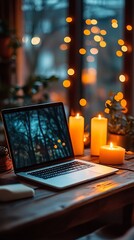 Wall Mural - Laptop on a wooden table with candles, space for text