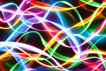 Wall Mural - Colorful glowing light waves on a dark background.