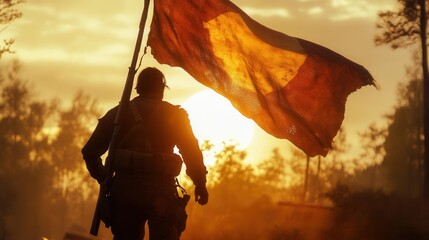 Soldier Silhouetted Against Sunset with Flag