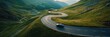 © Yeivaz - Aerial view of car and winding road in high mountain pass. Serpentine curvy road