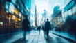 © fadi - business people walking in the corridor of an business center, pronounced motion blur, crowded bright modern light office movement defocused. office background busy. talking and rushing in the lobby.