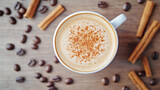 A beautifully crafted latte topped with sprinkle of cinnamon sits in white cup, surrounded by coffee beans and cinnamon sticks, creating warm and inviting atmosphere