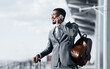 © Prostock-studio - Business Talk. African Man Talking on Phone at Airport and Waiting Taxi