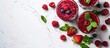 © StockKing - A delicious acai juice in glasses with mint and berries on a white marble table viewed from above with room for including text in the image. with copyspace image