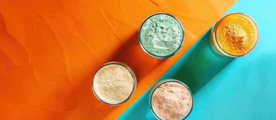 top down view of jars of protein powder displayed on a colorful background evoking a sports nutritio