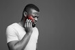 © Prostock-studio - Upset black guy suffering from strong pulpitis, white studio background, touching highlighted with red cheek, copy space