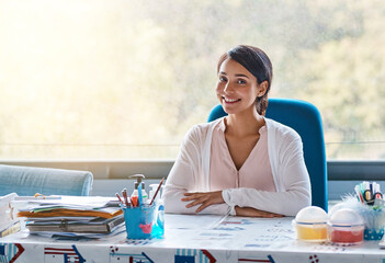 Poster - Woman, teacher and smile on desk in classroom with pride for education and lesson in Spain. Female person, employee and happy or satisfied on portrait with career growth and development in school