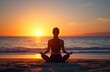 © Artem Zatsepilin - woman meditating on beach at sunset in lotus position near ocean, back view. silhouette of girl