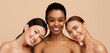 © Prostock-studio - Beauty Of Body. Three Multiracial Women Wrapped In Towels Posing Smiling To Camera Standing On Gray Background