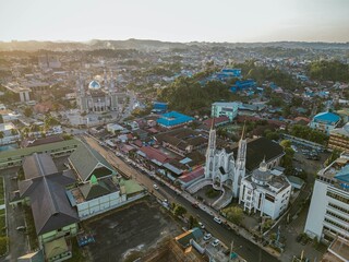 a view of al muminin mosque,  beside with Santa Maria Cathedral in samarinda from above 