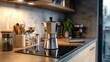 © Pricha.RT - A classic stovetop espresso maker sits on a sleek kitchen countertop, ready to brew rich, aromatic coffee in a cozy home setting.