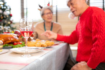 Family members gather to enjoy a meal together during the Christmas holiday at home