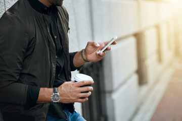 Wall Mural - Coffee, phone and hands of man in city for communication, social media and connection. Networking, newsletter and location app with person and mobile in urban downtown for search, digital or internet