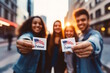 © MarGa - Diverse group of young voters proudly holding 'I Voted' stickers, standing in a city street during sunset. Represents youth engagement in democratic processes. Suitable for Election Day