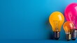 © Raitalinn - Colorful light bulbs on a blue background symbolize creativity, innovation, and bright ideas.